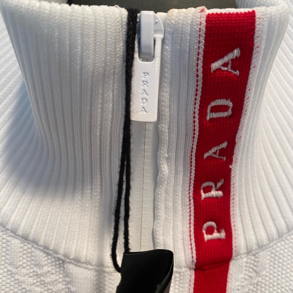 Prada attic white long sleeve tech top.
